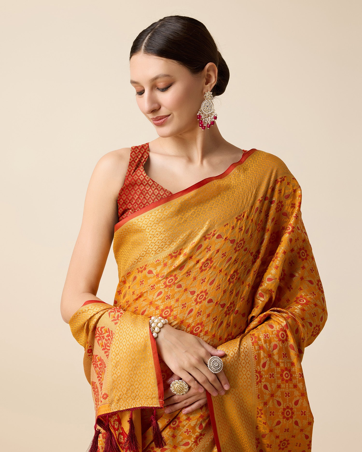 Pure Patola Silk Saree With All Over Contrast Patola Weaved With Contrast Meenakari And Rich Pallu With Tassels Attached Saree - Perfect for Partywear / Bollywood